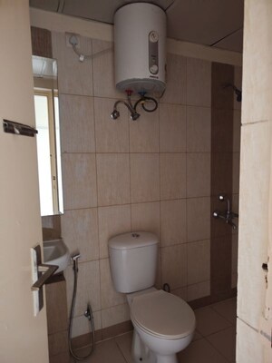 Bathroom in 3 BHK Apartment at Mahindra Aura, Sector 110a – for Rent