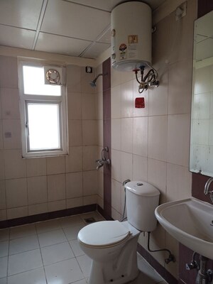 Bathroom in 3 BHK Apartment at Mahindra Aura, Sector 110a – for Rent