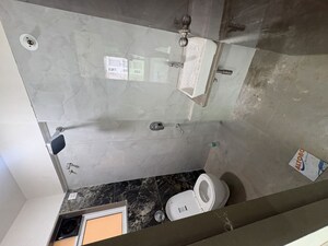 Bathroom in 2 BHK Apartment at Elite The Crown, Tilak Nagar – for Rent