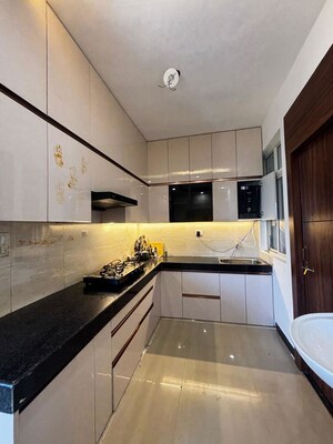 Kitchen in 2 BHK Apartment at Parthsarthy Enclave – for Sale