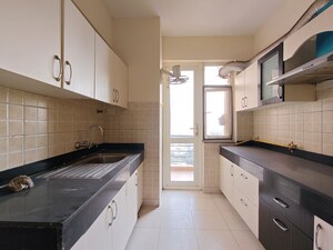 Kitchen in 3.5 BHK Apartment at Mahindra Aura, Sector 110a – for Rent
