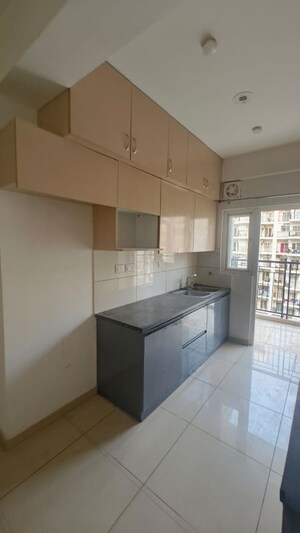 Kitchen in 2.5 BHK Apartment at Gulshan Botnia, Sector 144 – for Rent