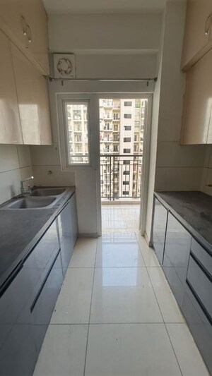 Kitchen in 2.5 BHK Apartment at Gulshan Botnia, Sector 144 – for Rent