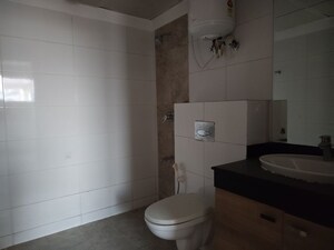 Bathroom in 4 BHK Apartment at Mahindra Aura, Sector 110a – for Rent