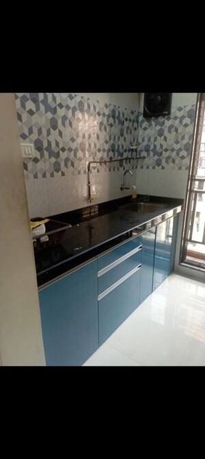 Kitchen in 1 BHK Apartment at Raunak Unnathi Woods Phase 7 A And B, Ghodbunder Road – for Rent