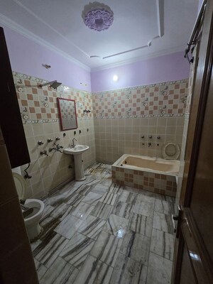 Bathroom in 3 BHK Apartment at Raj Nagar Extension – for Sale