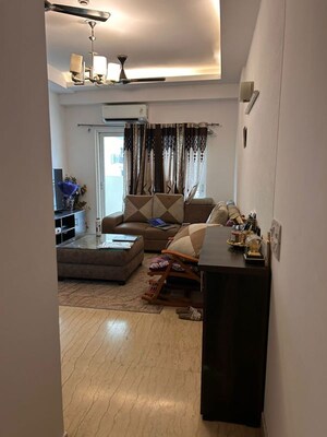 Living Room in 2.5 BHK Apartment at Mahagun Moderne, Sector 78 – for Rent