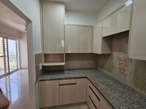 Kitchen in 3 BHK Apartment at Mahagun My Woods, Sector 16c Greater Noida – for Rent