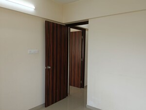 Master Bedroom in 2 BHK Apartment at Ram Pushpanjali Residency, Owale – for Rent