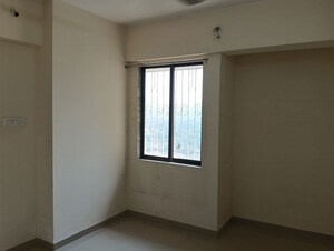 Master Bedroom in 2 BHK Apartment at Ram Pushpanjali Residency, Owale – for Rent