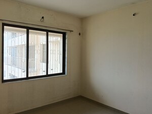 Bedroom in 2 BHK Apartment at Ram Pushpanjali Residency, Owale – for Rent