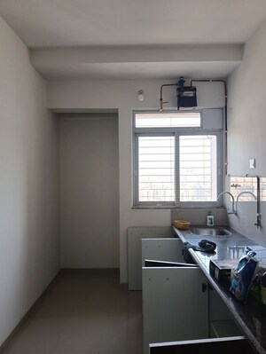 Kitchen in 2 BHK Apartment at Puranik City Reserva, Ghodbunder Road – for Rent