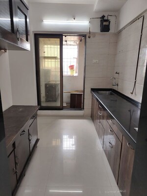 Kitchen in 2 BHK Apartment at Velocity Hill Spring Phase II, Ghodbunder Road – for Rent