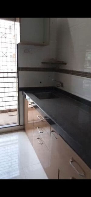 Kitchen in 2 BHK Apartment at Manohar Vikas Shreeji Paraiso Phase I, Badlapur East – for Sale
