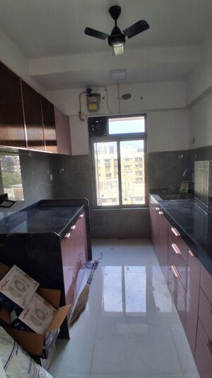 Kitchen in 2 BHK Apartment at Atharva Om Gautam Residency, Malad East – for Rent