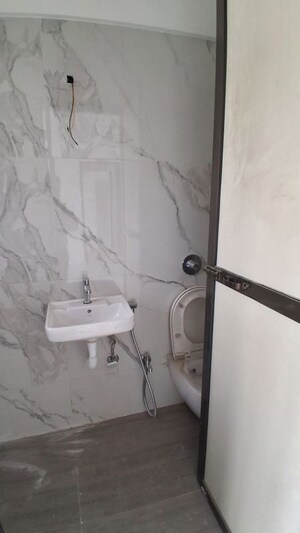 Bathroom in 2 BHK Apartment at Atharva Om Gautam Residency, Malad East – for Rent