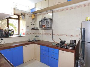 Kitchen in 2 BHK Apartment at Dhoot Sky Residency New Sonali CHSL, Malad West – for Rent