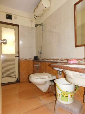 Bathroom in 2 BHK Apartment at Dhoot Sky Residency New Sonali CHSL, Malad West – for Rent