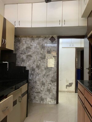 Kitchen in 2 BHK Apartment at Krishna Leela CHS Goregaon, Goregaon West – for Rent