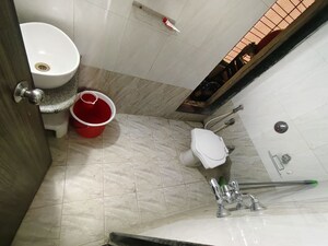 Bathroom in 2 BHK Apartment at Coral Heights, Kavesar – for Rent
