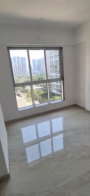 Bedroom in 2 BHK Apartment at Infinity Paradise CHS, Goregaon West – for Rent