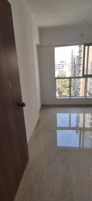 Master Bedroom in 2 BHK Apartment at Infinity Paradise CHS, Goregaon West – for Rent