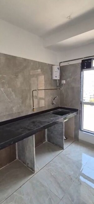 Kitchen in 1 BHK Apartment at Infinity Paradise CHS, Goregaon West – for Rent