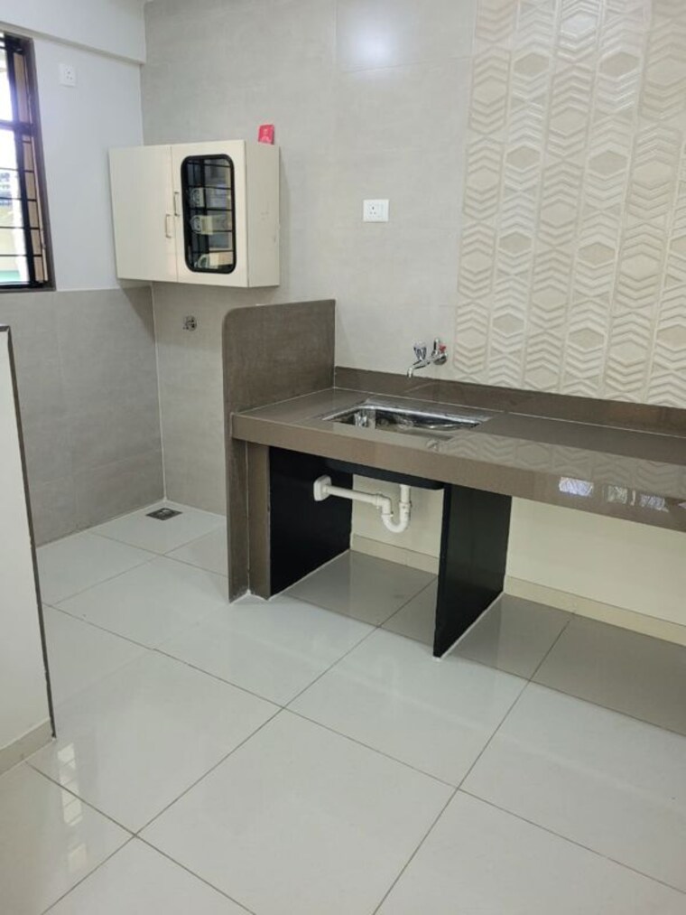 Kitchen, magarpatta-riverview-city-hornbill-heights 2 Bedroom 900 Sq.Ft. Apartment In Loni Kalbhor Pune 10363453