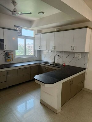 Kitchen in 4 BHK Apartment at Millenium Bajrang Society, Sector 43 – for Rent