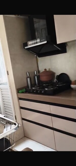 Kitchen in 1.5 BHK Apartment at Dosti West County, Balkum Pada – for Rent