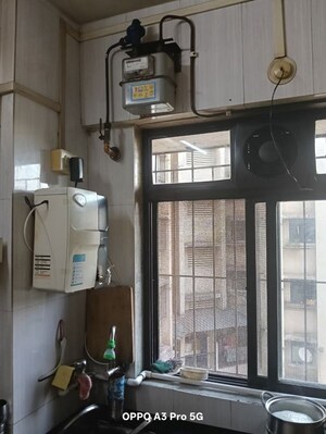 Kitchen in 2 BHK Apartment at Raunak Unnathi Woods Phase 4 And 5, Ghodbunder Road – for Rent