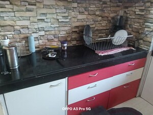 Kitchen in 2 BHK Apartment at Raunak Unnathi Woods Phase 4 And 5, Ghodbunder Road – for Rent