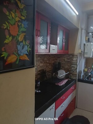 Kitchen in 2 BHK Apartment at Raunak Unnathi Woods Phase 4 And 5, Ghodbunder Road – for Rent