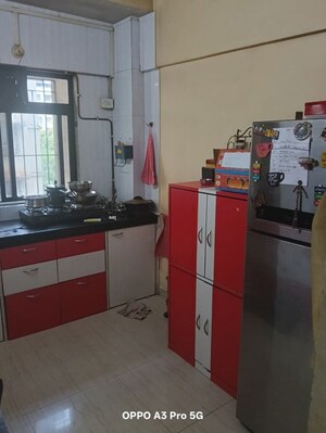 Kitchen in 2 BHK Apartment at Raunak Unnathi Woods Phase 4 And 5, Ghodbunder Road – for Rent