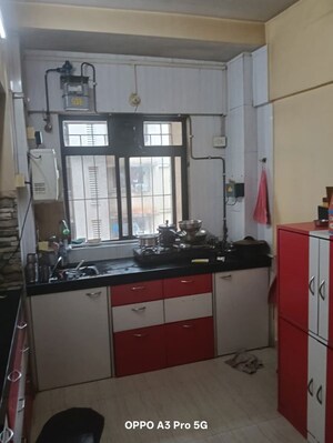 Kitchen in 2 BHK Apartment at Raunak Unnathi Woods Phase 4 And 5, Ghodbunder Road – for Rent