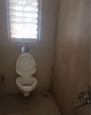 Bathroom in 2 BHK Apartment at Bharat Ecovistas, Shilphata – for Rent