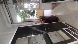 Kitchen in 1 RK Apartment at Raheja Atlantis II, Sector 31 – for Rent