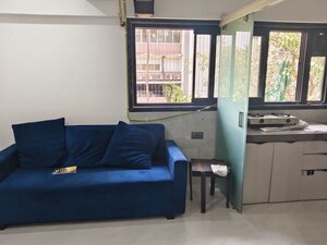 Living Room in 1 BHK Apartment at Vile Parle West – for Rent
