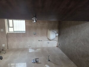 Bathroom in 1 BHK Apartment at Cosmos Habitat, Majiwada – for Rent