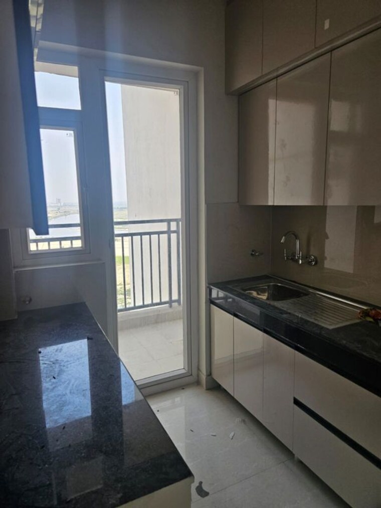 Kitchen, eldeco-live-by-the-greens 2 Bedroom 1137 Sq.Ft. Apartment In Sector 150 Noida 10365033