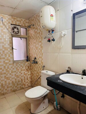 Bathroom in 2.5 BHK Apartment at Nimbus The Golden Palm, Sector 168 – for Rent