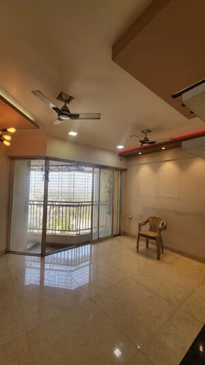 Living Room in 2 BHK Apartment at Bharat Ecovistas, Shilphata – for Rent