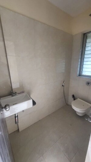 Bathroom in 2 BHK Apartment at Bharat Ecovistas, Shilphata – for Rent
