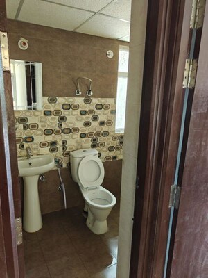 Bathroom in 3 BHK Apartment at Raj Nagar Extension – for Rent