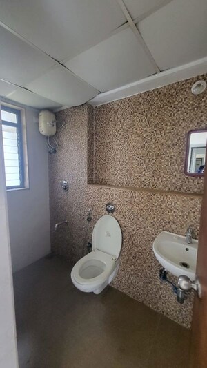 Bathroom in 1 BHK Apartment at Lodha Lakeshore Greens, Dombivli East – for Rent