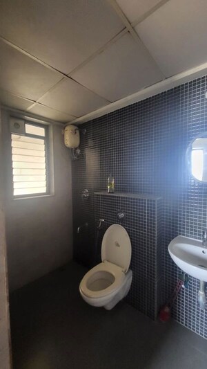 Bathroom in 1 BHK Apartment at Lodha Lakeshore Greens, Dombivli East – for Rent