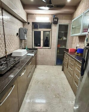 Kitchen in 3 BHK Apartment at Kalpa Taru Siddhachal III, Vasant Vihar – for Rent