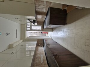 Kitchen in 3.5 BHK Apartment at Amrapali Hanging Gardens, Sector 107 – for Sale