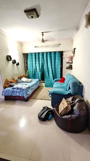 Living Room in 1 BHK Apartment at Onkar CHS, Goregaon East – for Rent
