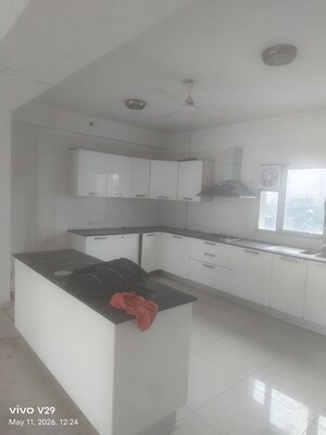 Kitchen in 4 BHK Apartment at Tata Raheja Raisina Residency, Sector 59 – for Rent
